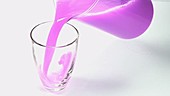 Purple liquid in jug, slow motion