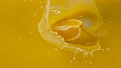 Orange in juice, slow motion