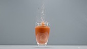 Tomato juice spilling, slow motion