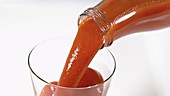 Tomato juice being poured, slow motion