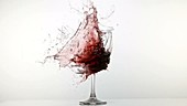 Glass of wine exploding, slow motion