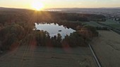 Sunset over fish pond, drone footage