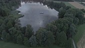 Misty lake at dusk, drone footage