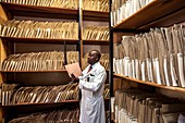 Hospital doctor consulting patient records