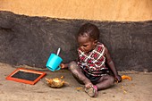 Young boy eating and drinking
