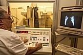 Radiographer carrying out an X-ray