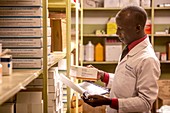 Pharmacist handling nonsteroidal anti-inflammatory drug