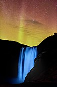 Northern Lights over Skogafoss waterfall, Iceland