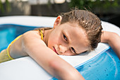 8 year old child in an inflatable pool