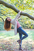 Woman hanging from a tree