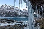 Icicles by a frozen waterfall in the Swiss Alps