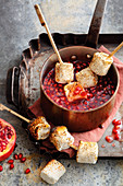 pomegranate fondue with grilled marshmallows