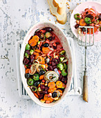 Oven-roasted winter vegetables with olives and orange juice