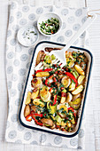 Oven roasted potato wedges with leeks and peppers