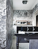Black and white cloud-patterned wallpaper in elegant bathroom