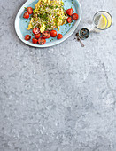 Scrambled eggs with sprouts and cocktail tomatoes