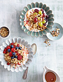 Buckwheat cereal with berries, and almond muesli with grapes