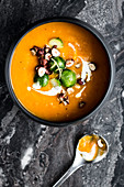 Pumpkin soup with brussels sprouts and goat's cheese