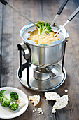 Cheese curry fondue with broccoli