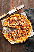 Potato pizza with anchovies and red onions