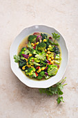 Broccoli, spinach and chickpeas in a turmeric broth