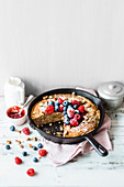 Chocolate cheesecake with berries in a pan