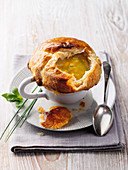 Vegetable soup with a puff pastry topping
