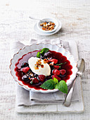 Cold berry dessert with sour cream ice cream and brittle