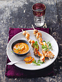 Satay skewers with a peanut and coconut sauce