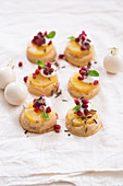 Pineapple tartlets and chilli and pomegranate seeds