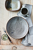 A bowl and a jug on a wooden table