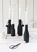 Hand-made Advent wreath made from black bottles