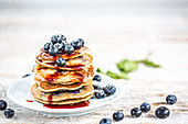 Blueberry pancakes with blueberries and maple syrup