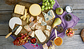 A cheese platter with dips and fruit