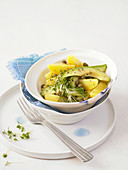 Potato salad with avocado, capers and cress