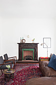 Vintage leather sofa, fireplace and chairs in lounge