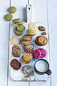 Various flavored cookies on a wooden board