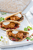 Summer chicken skewers with pomegranate salsa in unleavened bread (Morocco)
