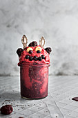 A frozen berry smoothie with bananas, chia seeds and almond milk