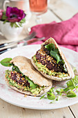 Beetroot falafel with avocado and chilli in pitta bread
