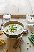 Spring onion and potato soup with cream and black pepper