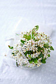 Bride's posy of white flowers and tulle