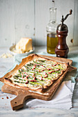 Tart flambeé with green asparagus and bacon strips