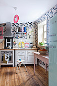 Retro polka-dot wallpaper in eclectic kitchen