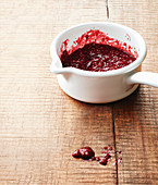 Pureed raspberry sauce in a saucepan