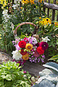 Basket of pompon dahlias, phlox and snapdragons