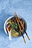 Asian noodle soup with beef and vegetables