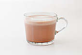 A glass of chamois milk with cocoa, tea and rum