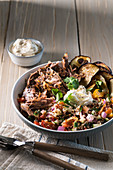 Slow cooked pulled lamb with a quinoa and tomato salad
