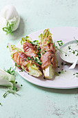 Roasted chicory with Gruyére wrapped in Parma ham